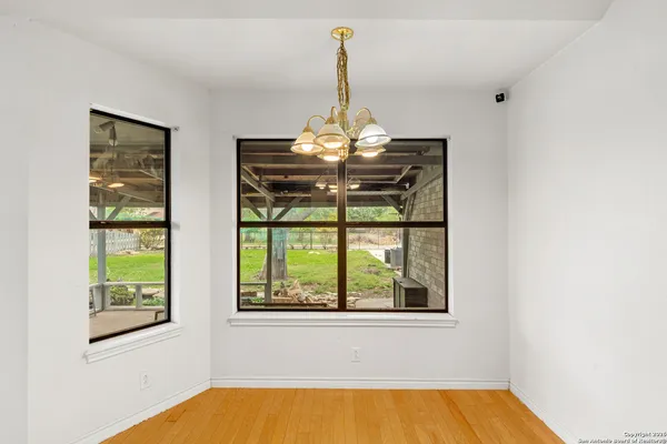 a view of a room with furniture and a window
