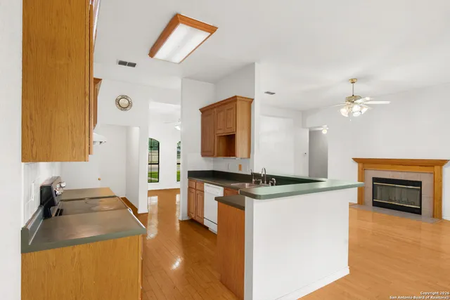 a kitchen with a stove and a sink