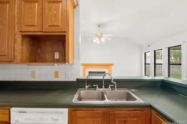 a kitchen with a sink and a window