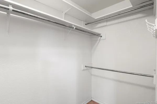 a view of a room with racks on the wall