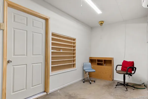a bathroom with a sink mirror vanity and toilet