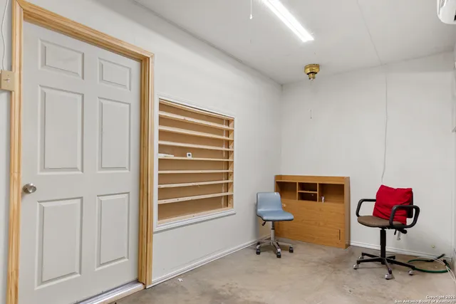 a bathroom with a sink mirror vanity and toilet