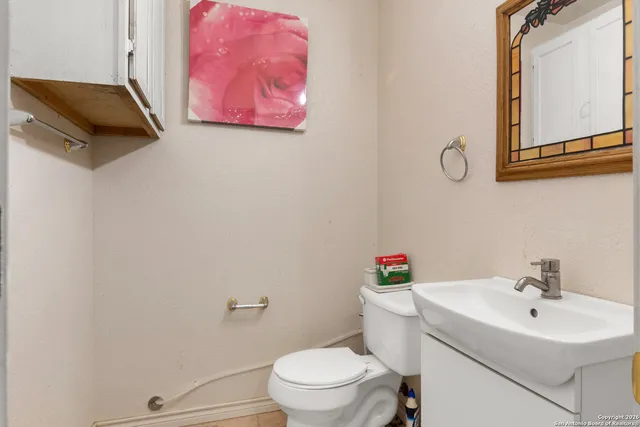 a front view of a house with yard and green space