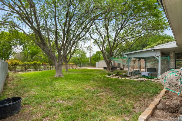 an aerial view of residential house with outdoor space