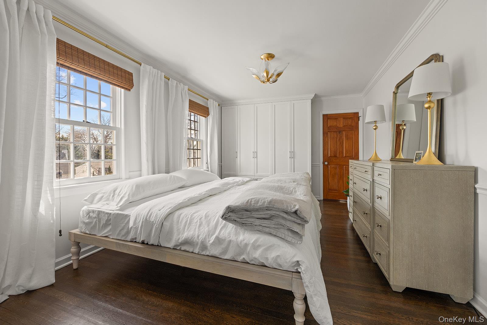 147 Valley Stream Road East Larchmont, NY 10538 - Photo 13 of 37 a spacious bedroom with a bed and wooden floor