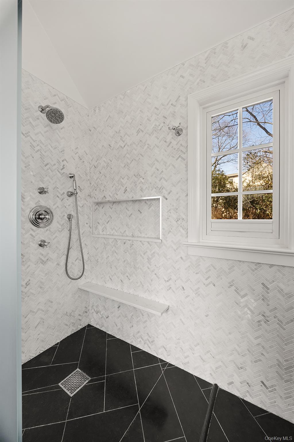 147 Valley Stream Road East Larchmont, NY 10538 - Photo 15 of 37 a bathroom with a granite countertop sink a window and a shower