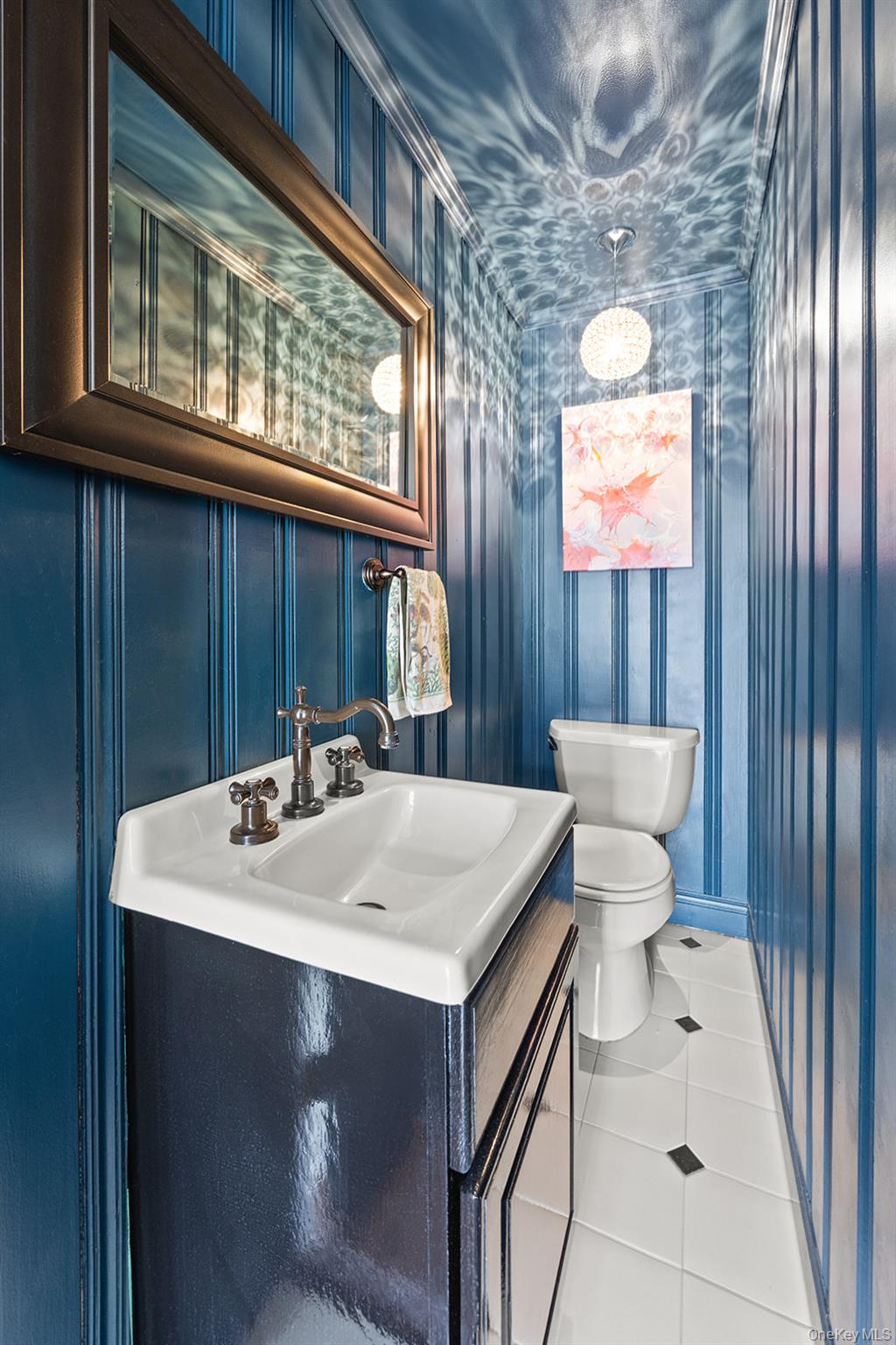 147 Valley Stream Road East Larchmont, NY 10538 - Photo 26 of 37 a bathroom with a sink a toilet and mirror