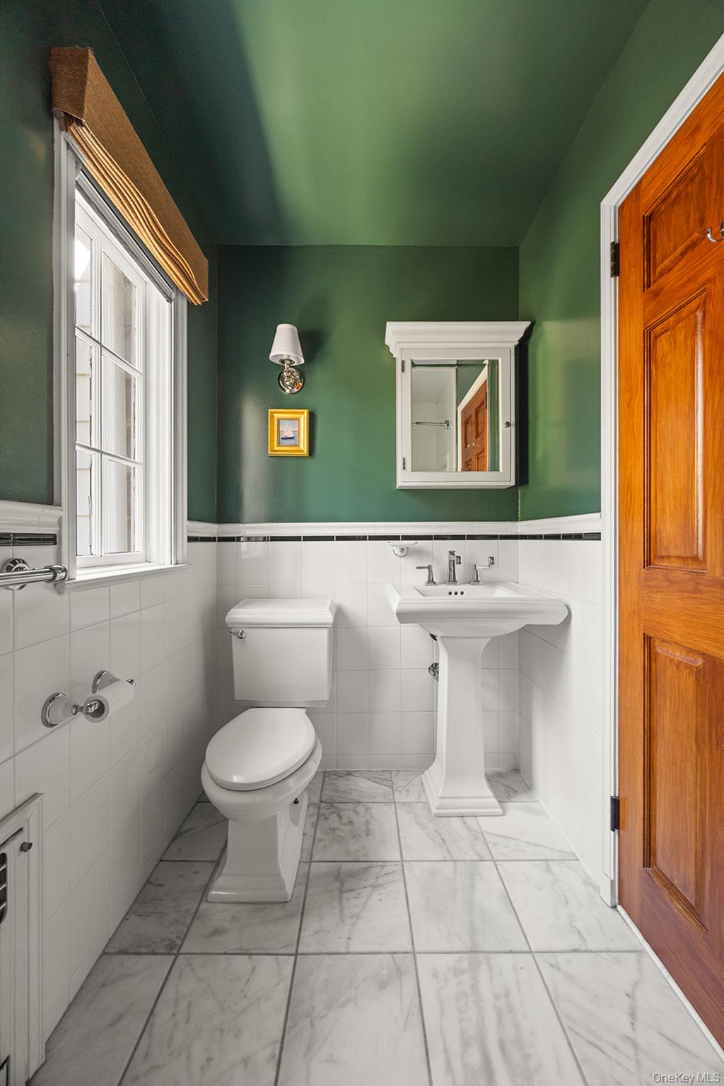 147 Valley Stream Road East Larchmont, NY 10538 - Photo 27 of 37 a bathroom with a toilet a sink and a mirror