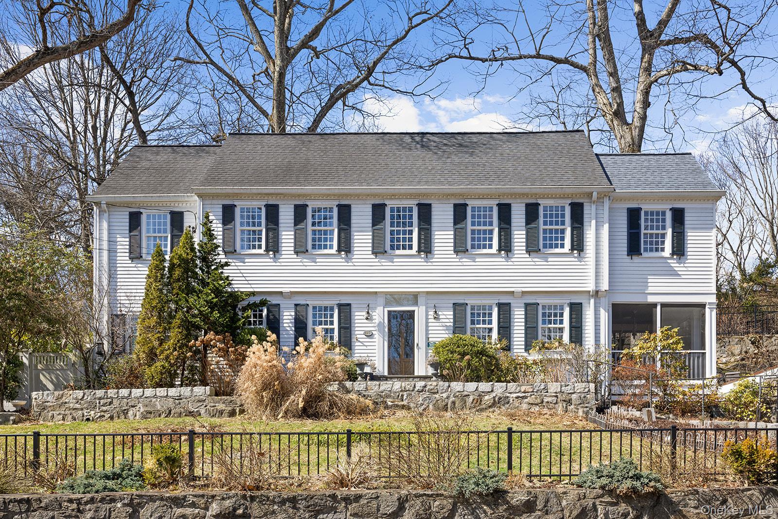 147 Valley Stream Road East Larchmont, NY 10538 - Photo 32 of 37 front view of a house with a fence