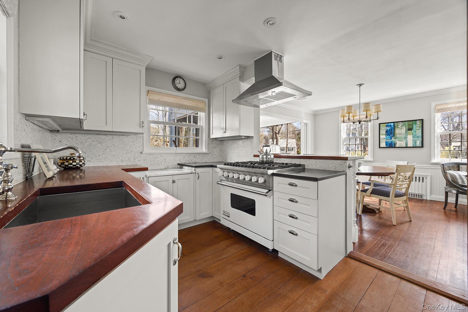 147 Valley Stream Road East Larchmont, NY 10538 - Photo 8 of 37 a kitchen with white cabinets and white appliances