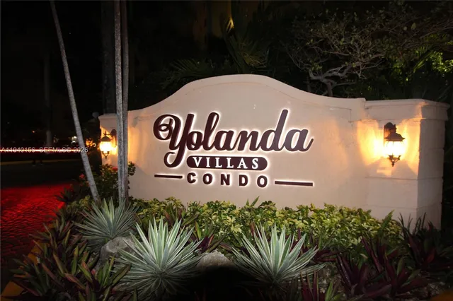 a view of a swimming pool with an outdoor seating