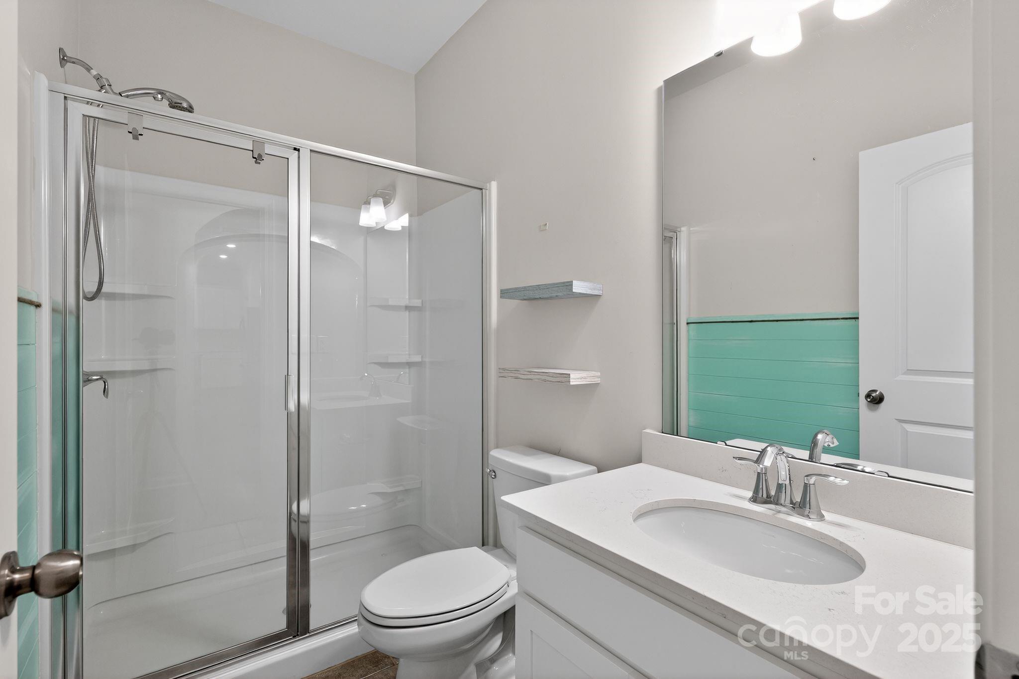 130 Dry Rivers Lane Mooresville, NC 28117 - Photo 21 of 30 a bathroom with a sink toilet and shower