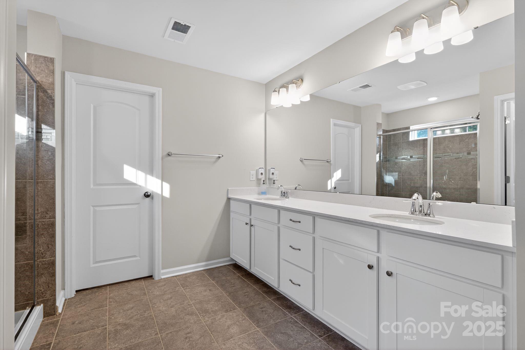 130 Dry Rivers Lane Mooresville, NC 28117 - Photo 22 of 30 a bathroom with double sink and a mirror