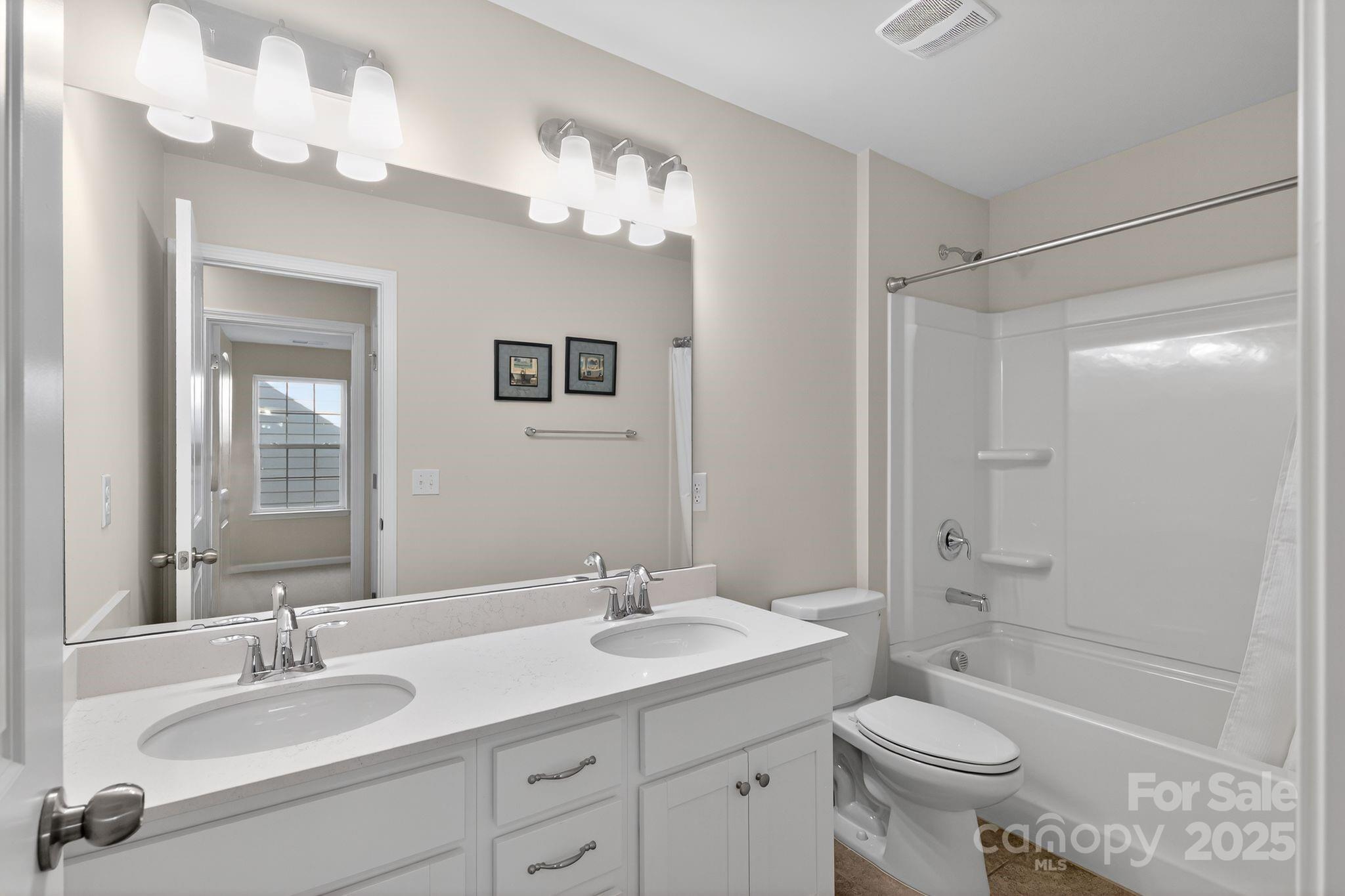 130 Dry Rivers Lane Mooresville, NC 28117 - Photo 23 of 30 a bathroom with a sink a toilet a mirror a bathtub and shower