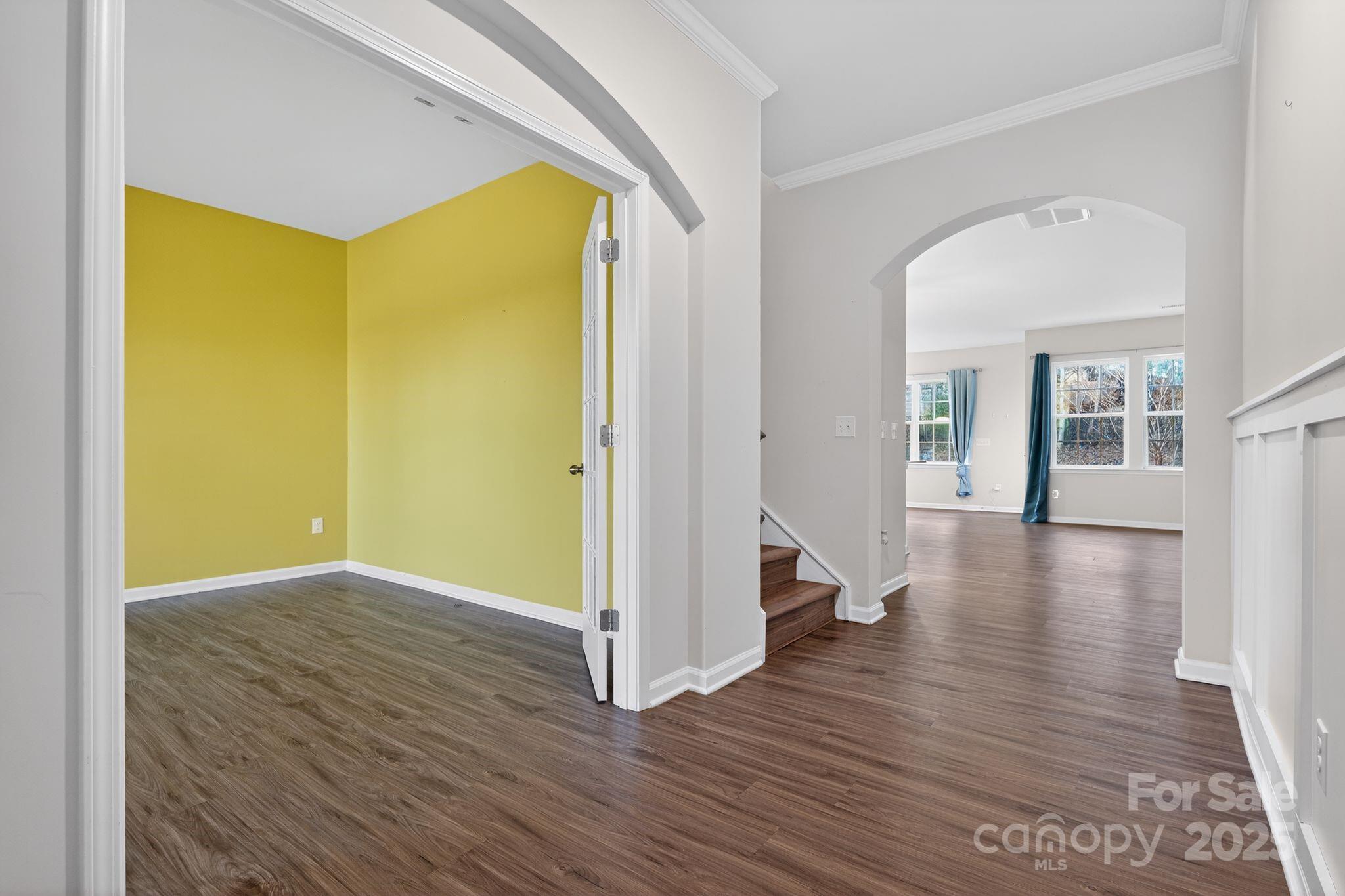 130 Dry Rivers Lane Mooresville, NC 28117 - Photo 3 of 30 an empty room with wooden floor and a window