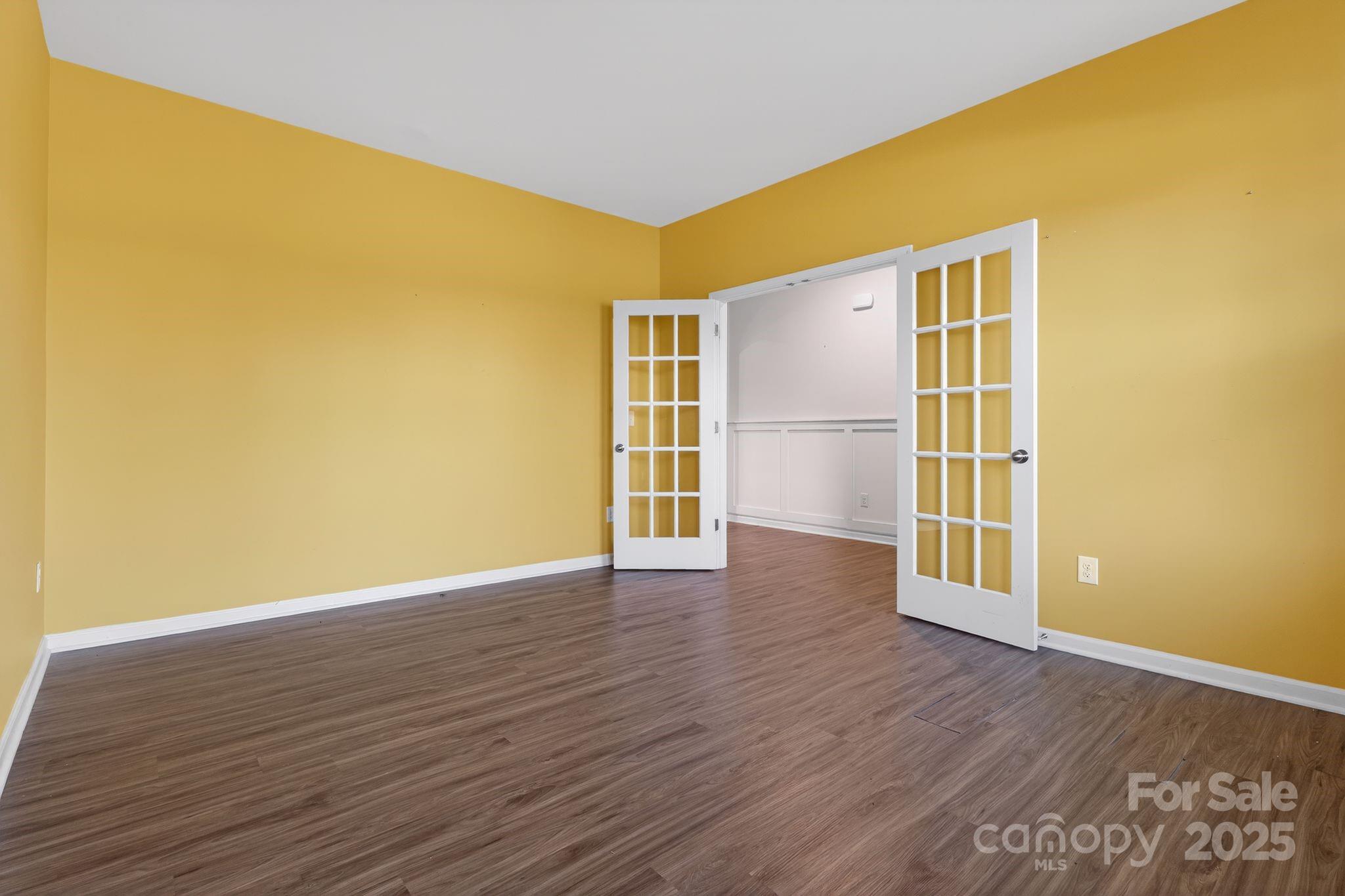 130 Dry Rivers Lane Mooresville, NC 28117 - Photo 10 of 30 a view of a big room with wooden floor and windows