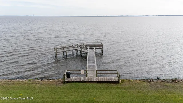 an aerial view of residential house with outdoor space and swimming pool