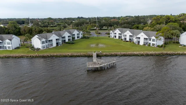 a view of a lake with a bench in the ocean
