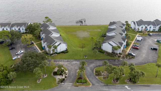 a aerial view of a house with a big yard