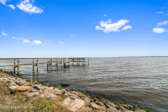 an aerial view of a house with outdoor space