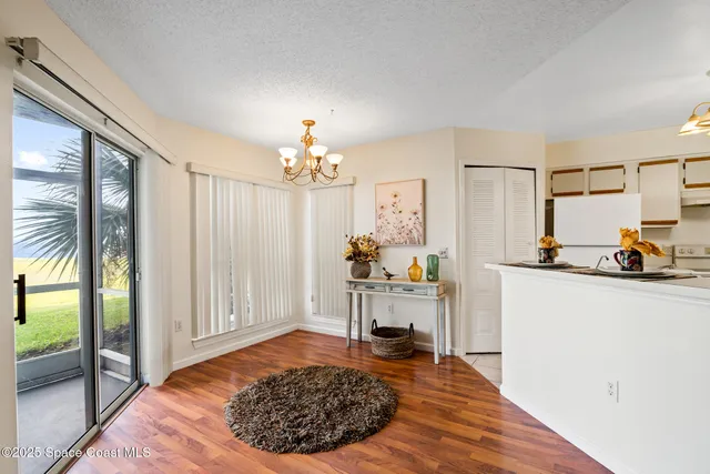 a view of a livingroom with furniture and a flat screen tv