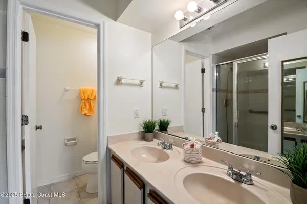 an empty room with a window and ceiling fan