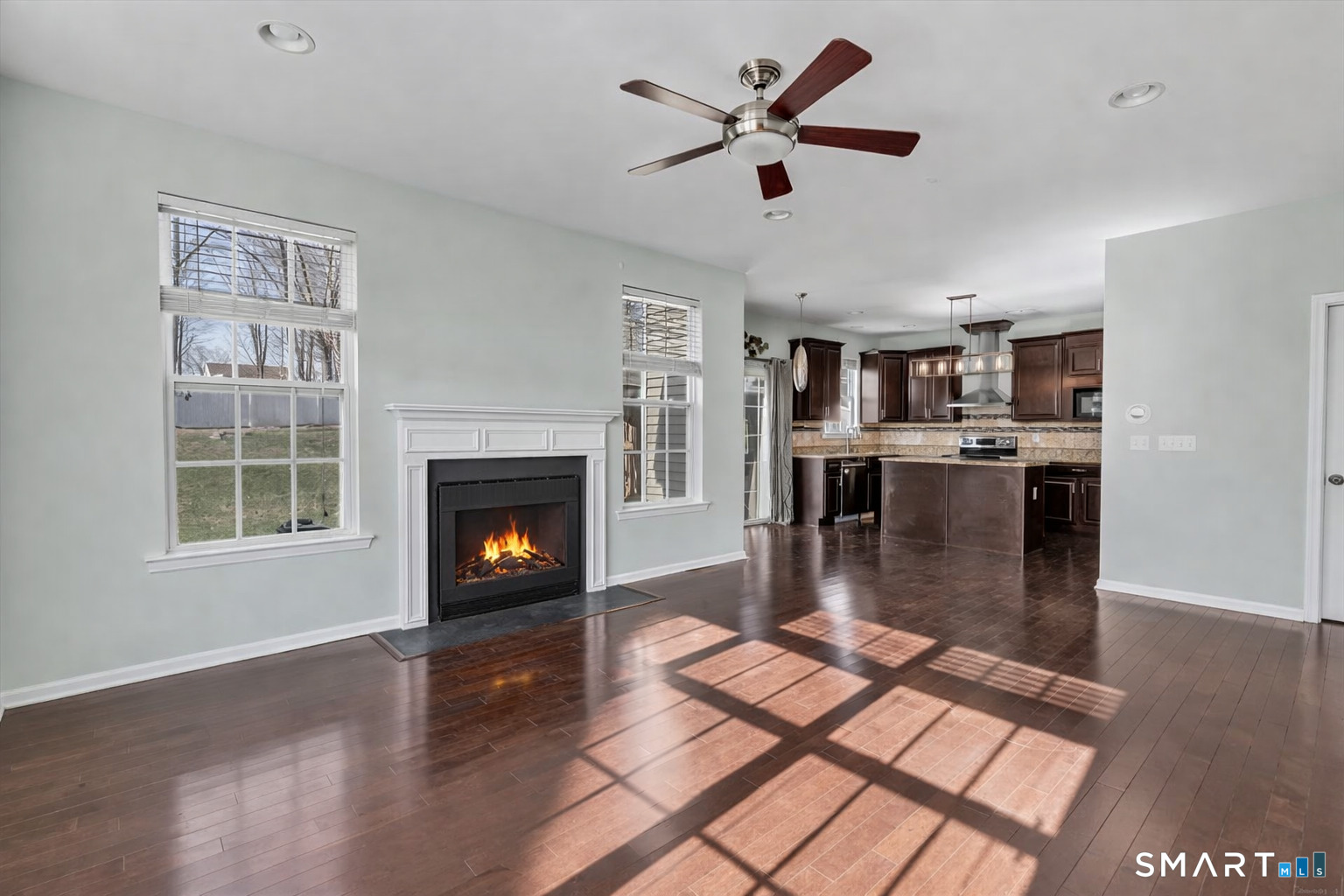 9 Fox Run Lane Seymour, CT 06483 - Photo 9 of 39 a living room with stainless steel appliances kitchen island granite countertop a fireplace a dining table and a fireplace