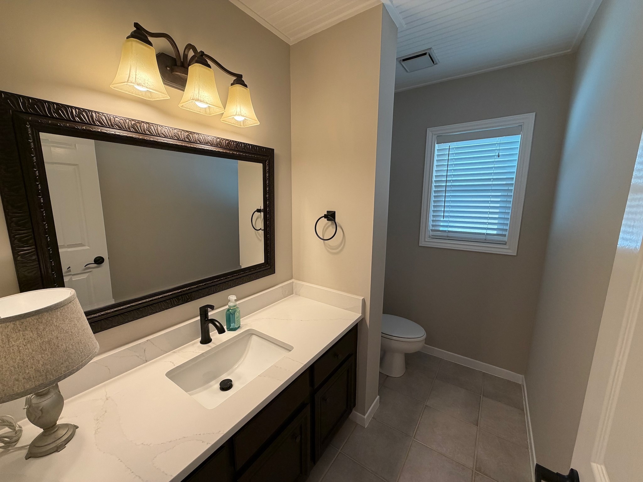 2326 Streamcrest Lane Sugar Land, TX 77479 - Photo 18 of 42 Half bath with ample cabinet storage and Quartz Counter.