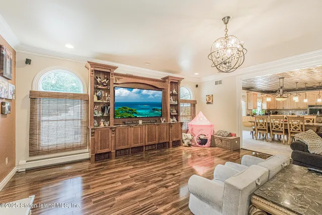 a large kitchen with stainless steel appliances granite countertop a sink and cabinets