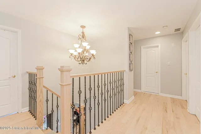 a bedroom with a bed and a ceiling fan