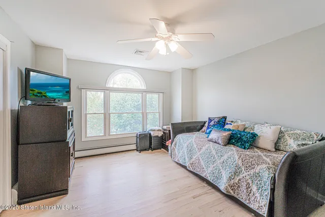 a kitchen with cabinets appliances a sink and a window