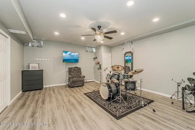 a view of a dining room with furniture and floor to ceiling window