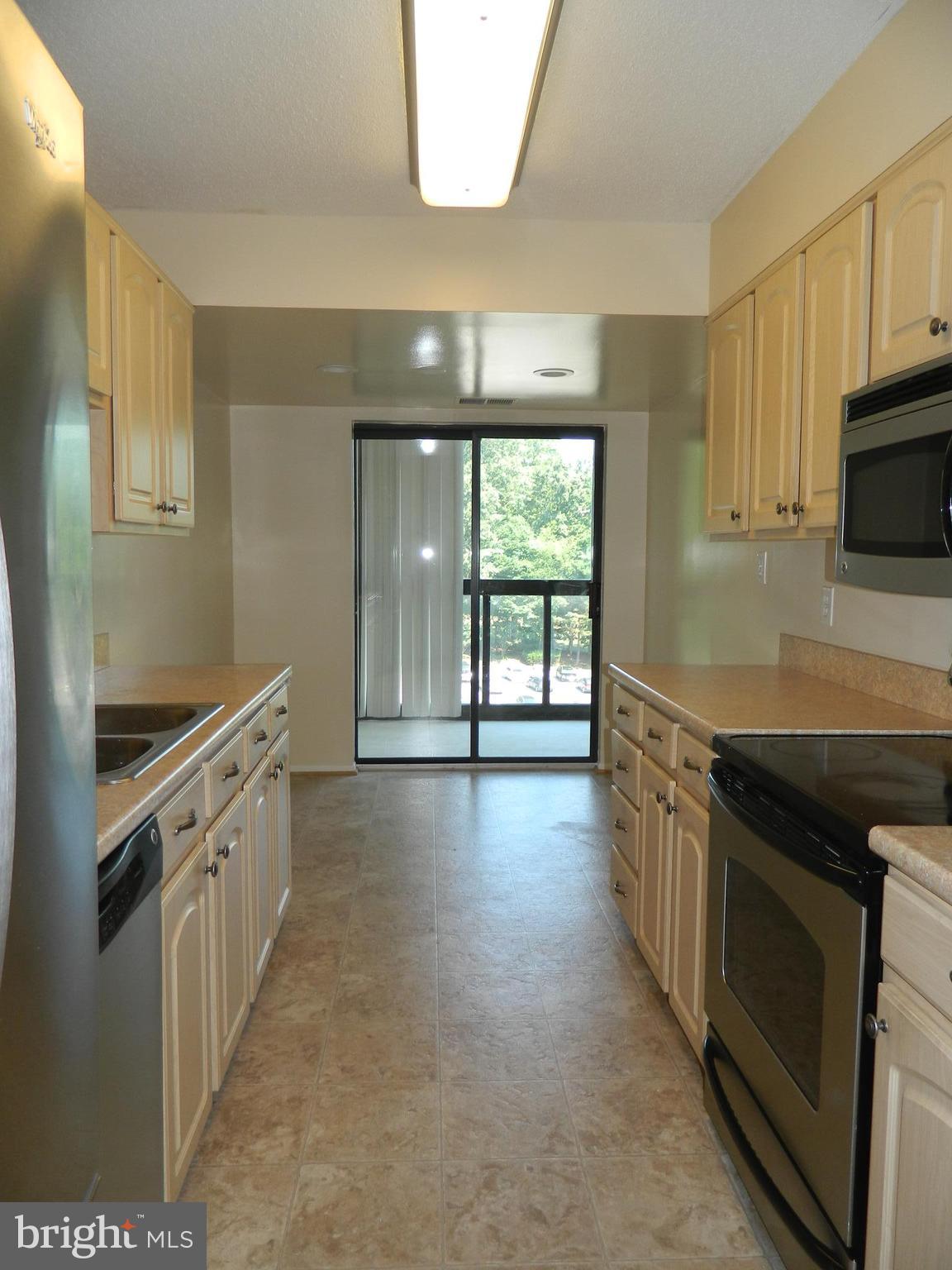 15100 Interlachen Drive, Unit 4521 Silver Spring, MD 20906 - Photo 11 of 27 Kitchen with access to Enclosed Balcony