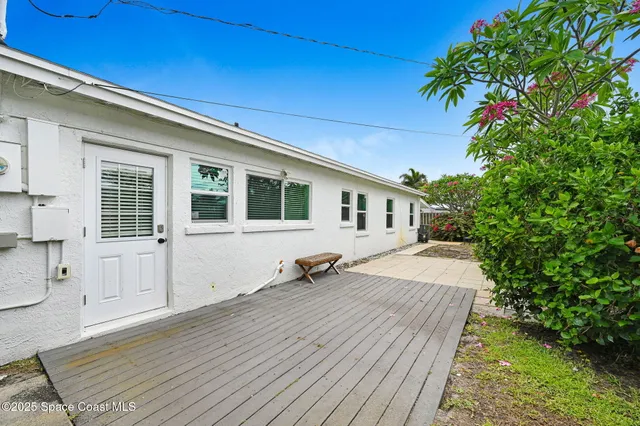 a backyard of a house with seating space