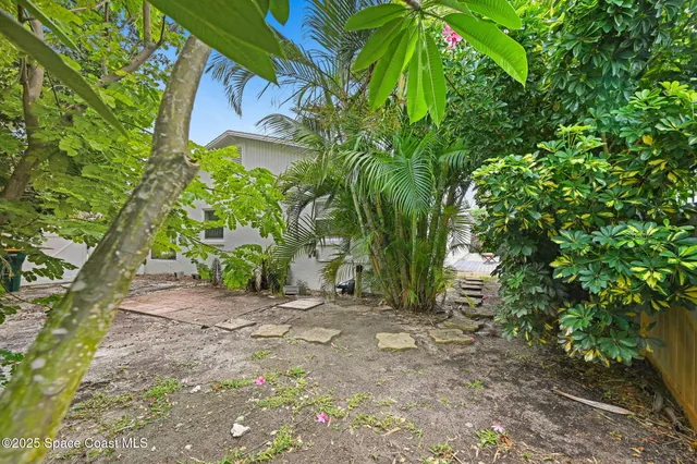 a house view with a garden space