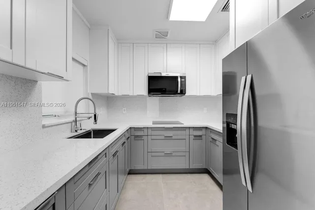 an empty room with closet and cabinet