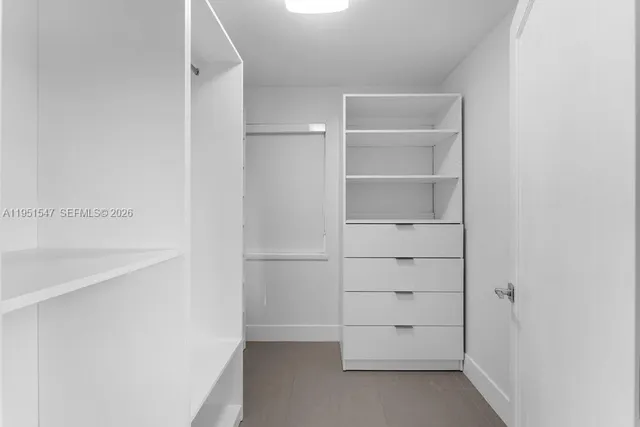 a bathroom with a shower toilet and sink