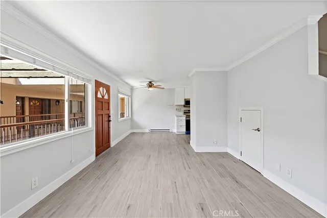 a view of entryway and hall with wooden floor