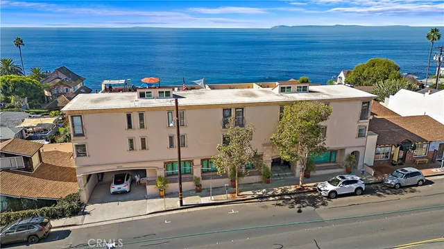 an aerial view of a house with a street
