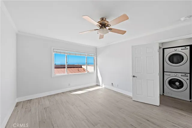 a view of ocean with a building in the background