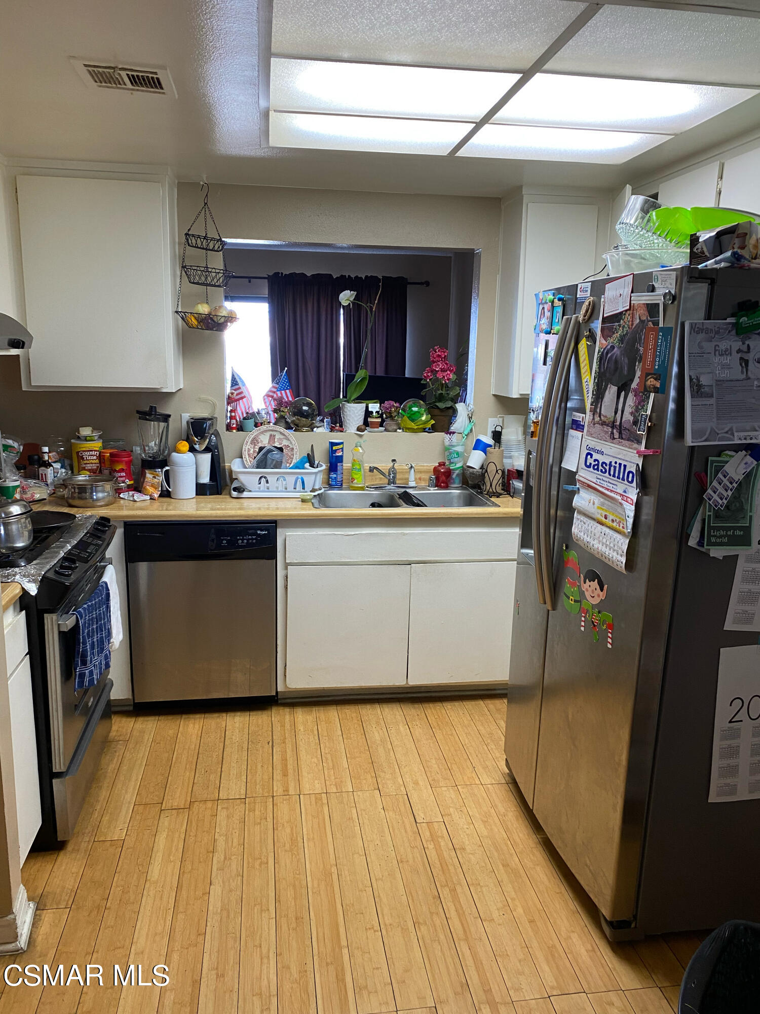5111 Perkins Road, Unit 4 Oxnard, CA 93033 - Photo 6 of 17 a view of a kitchen with appliances and cabinets