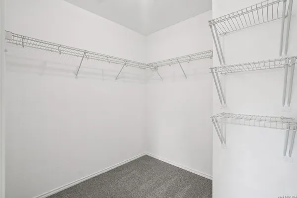 a view of a room with racks on the wall