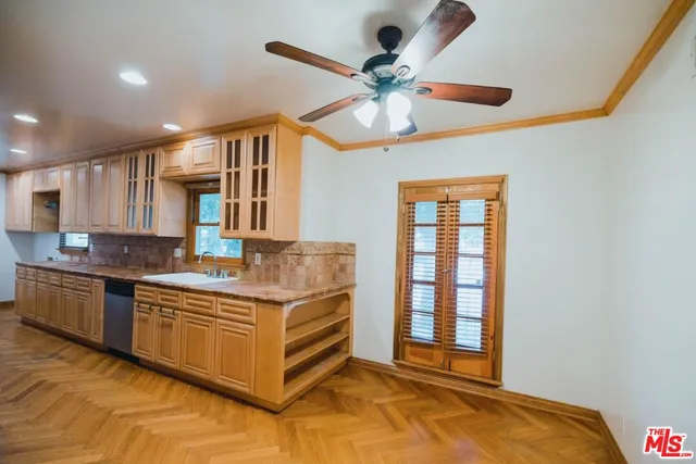 a kitchen with stainless steel appliances granite countertop a stove and a sink