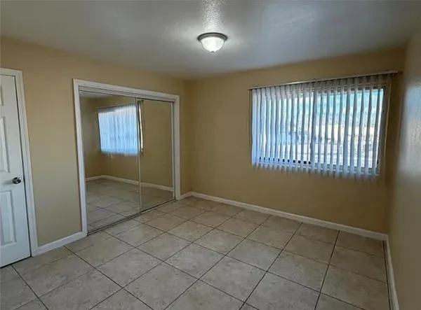 a view of an empty room and window