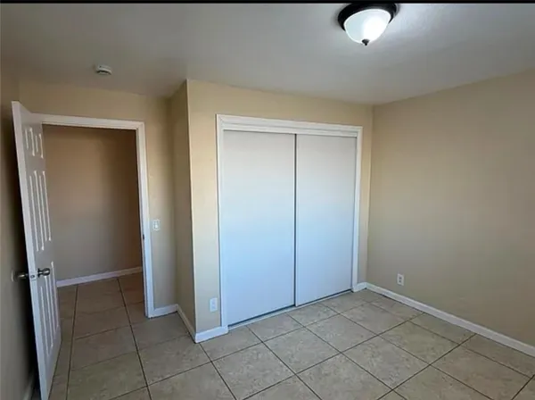 a kitchen with granite countertop a refrigerator and a stove