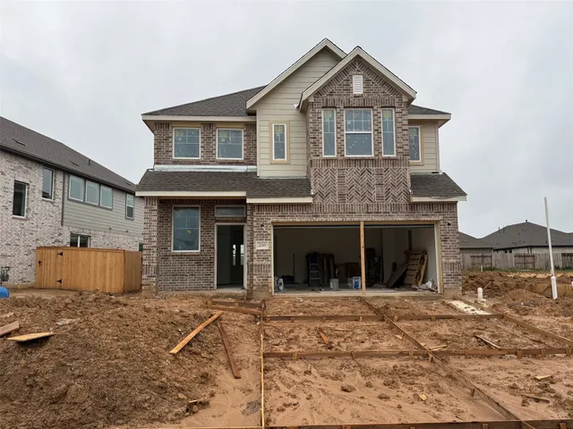 a view of a house with a yard and garage