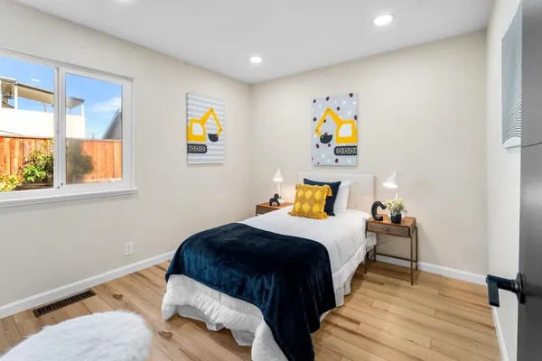 a bedroom with a bed and window