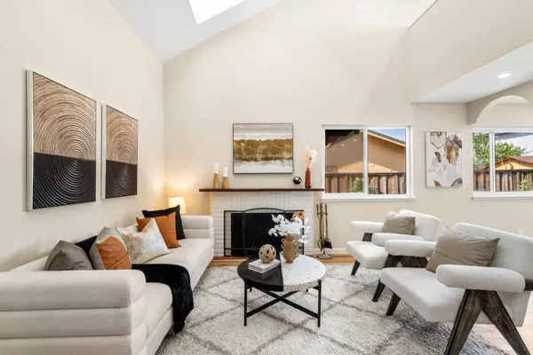 a living room with furniture fireplace and a flat screen tv