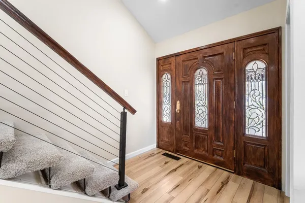 a view of front door with stairs