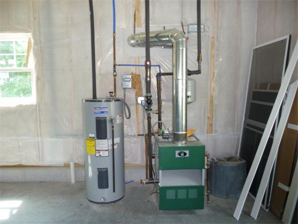 60 A Nashua Road Pepperell, MA 01463 - Photo 13 of 16 a room with water heater and a window